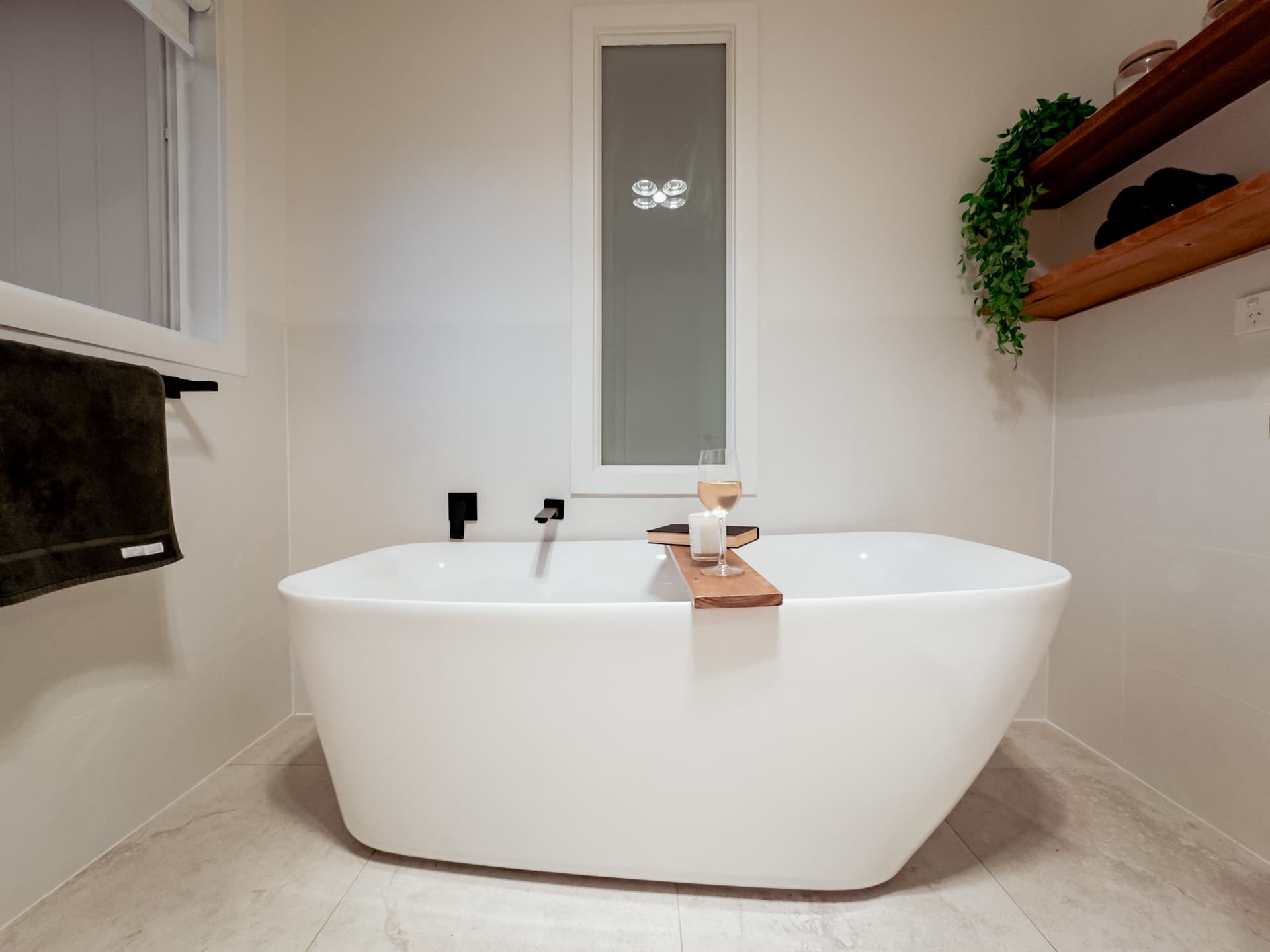 Freestanding soaking bathtub in main bathroom at Big Isle Retreat