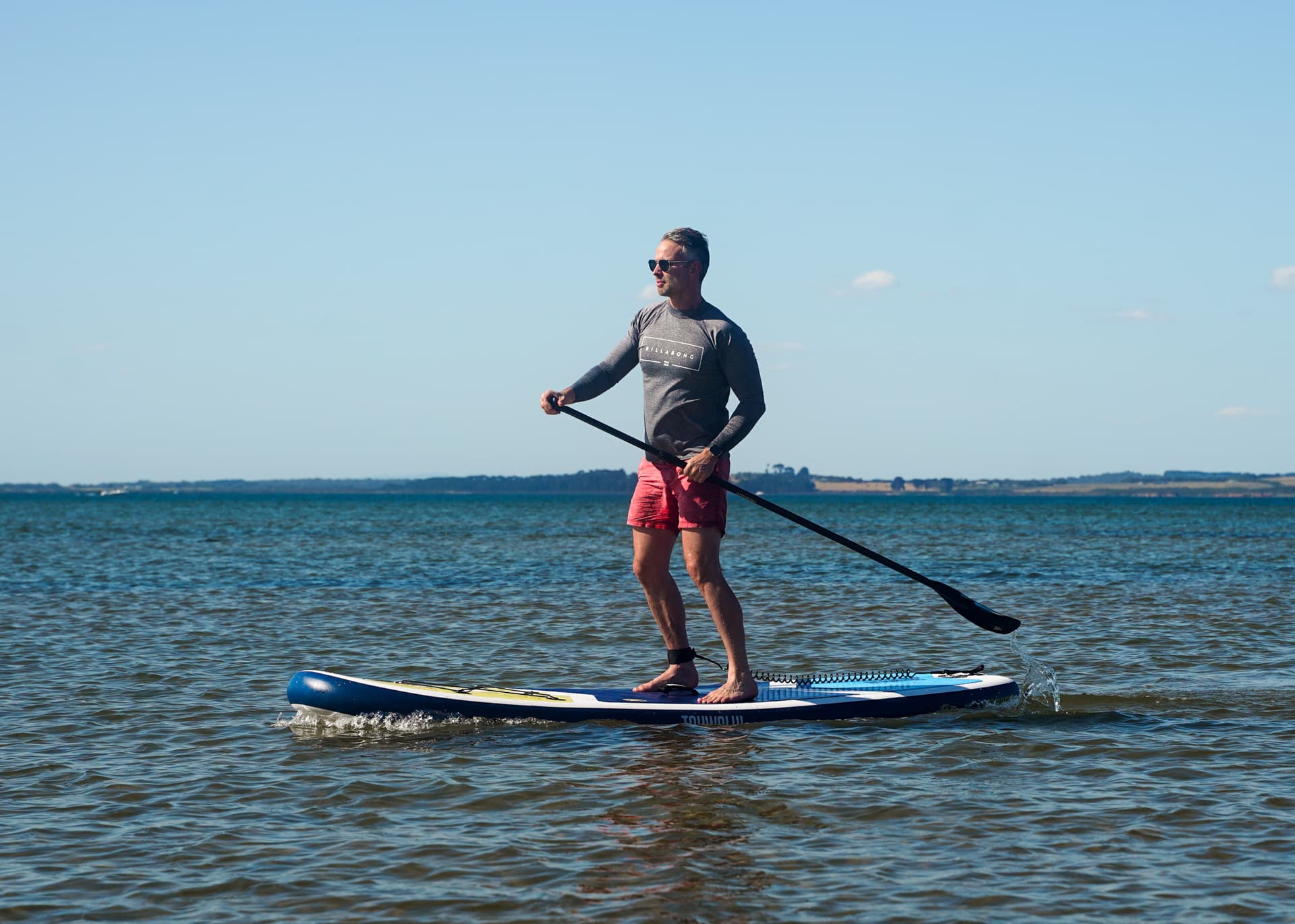 Stand-up paddleboarding at Cowes main beach, Phillip Island