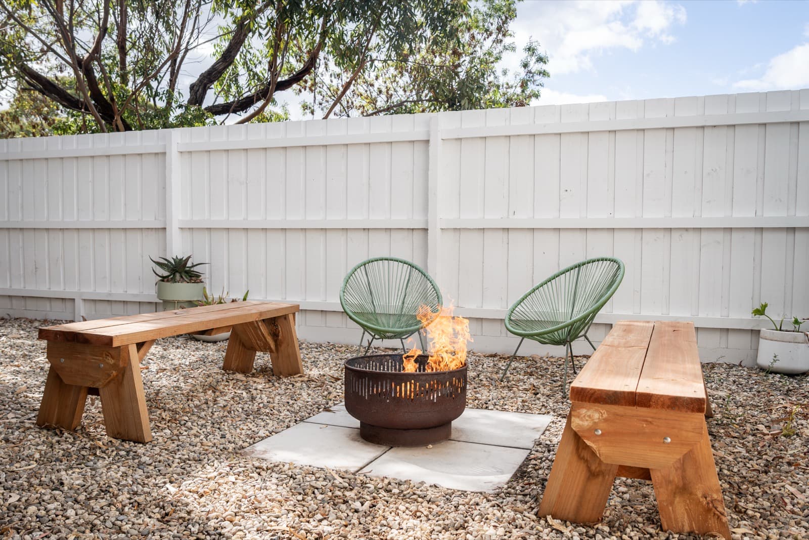 Fire pit area with seating at Big Isle Retreat, Phillip Island