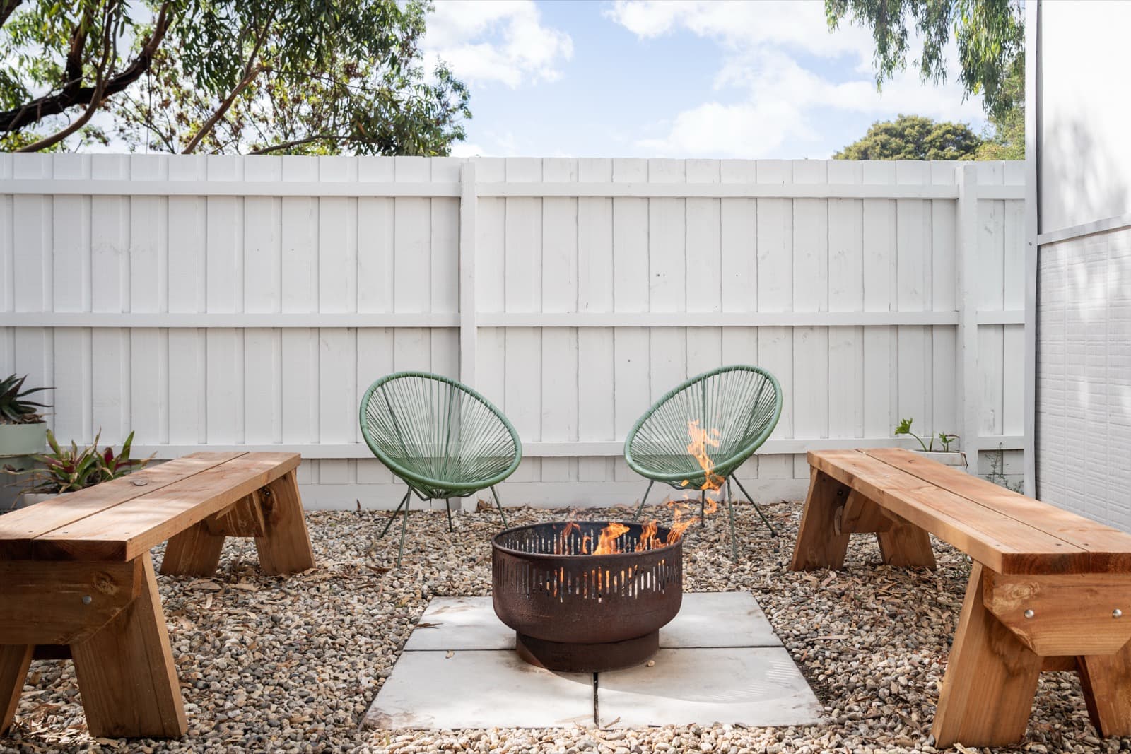Fire pit close-up with flames at Big Isle Retreat, Cowes