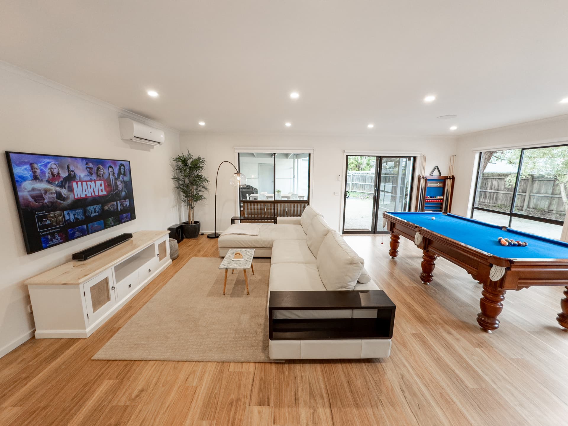 Entertainment room with pool table and 75 inch TV at Big Isle Retreat